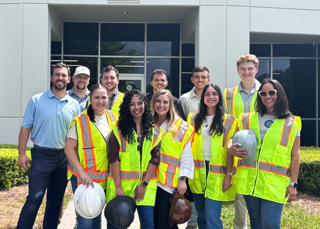 Perimeter Floors team members stand outside company headquarters in Cobb County.